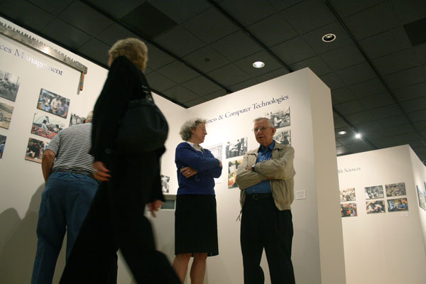 Elaine J. Lambert, director of college information and community relations, visits with Chalmer Van Horn, who taught drafting at all three institutions detailed in the gallery exhibit.