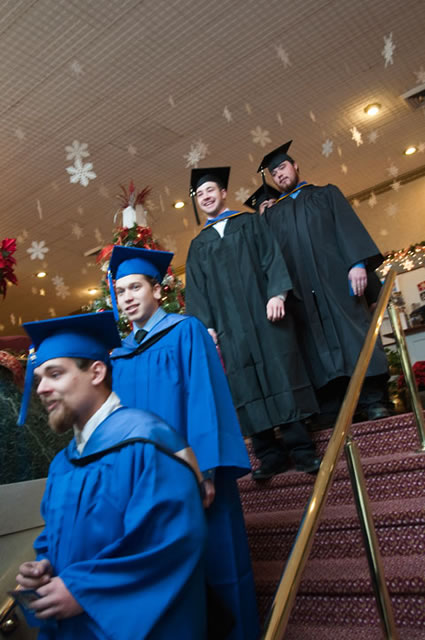 Students process from a festive Genetti Hotel.