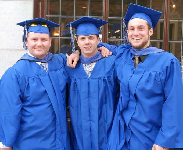 A loyal trio of heating, ventilation and air conditioning majors sticks together during the procession.