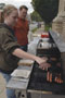 Community assistant Danielle M. Coakley grills hamburgers and hot dogs with Elliott J. Strickland, special assistant to the vice president for student affairs, during Wednesday's 'Vine Avenue Meet & Greet'