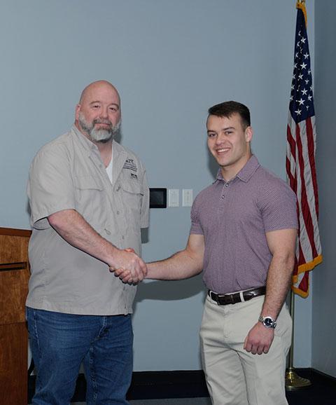 Sheppard announces the imminent commencement award for Roe, an ROTC cadet who told the corporate partners of his Army Corps of Engineers internships stateside and in the Middle East. Soon to be commissioned as a second lieutenant, he is headed to helicopter flight school in Alabama.