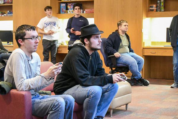 Benji J. Babinsack (left), of Williamsport, a machine tool technology student, and Hunter B. Hockman, of Accident, Md., enrolled in game & simulation programming, square off in the evening's first race.