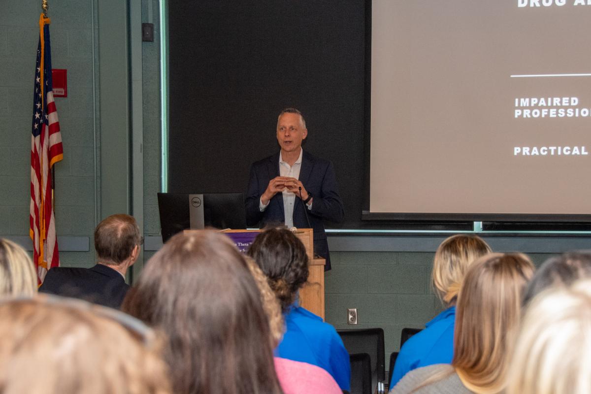 Penn College President Michael J. Reed introduces McGill to an audience of nearly 50 health care students, providers and educators.