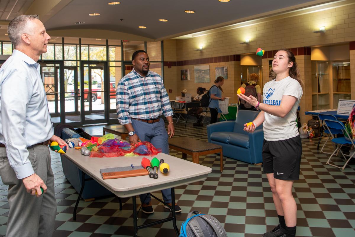 Accustomed to juggling soccer balls, Wildcat goalkeeper Nichole R. Lichtinger tries her hand at a smaller task. She’s an emergency management & homeland security student. 