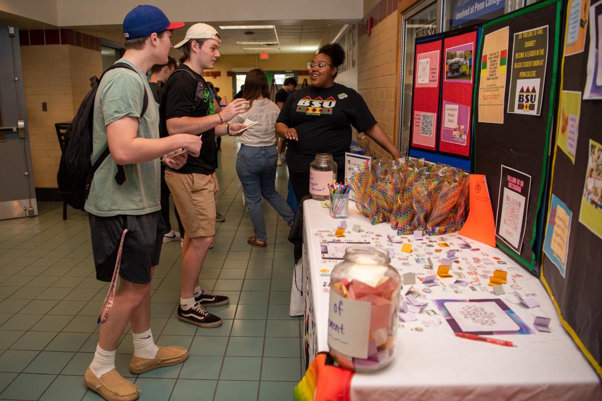 At the Black Student Union display, Chyanna L. Galagarza invites students to sign up for stress-relieving giveaways. Galagarza is a human services & restorative justice student. 
