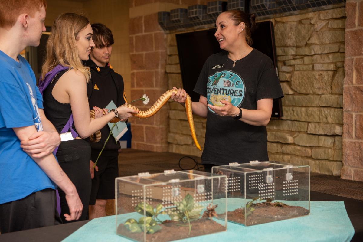 Armed with an “animal ambassador” of the reptilian kind, Holly Rennell, animal educator with State College-based Exotic Edventures, helps students step outside their comfort zones. 