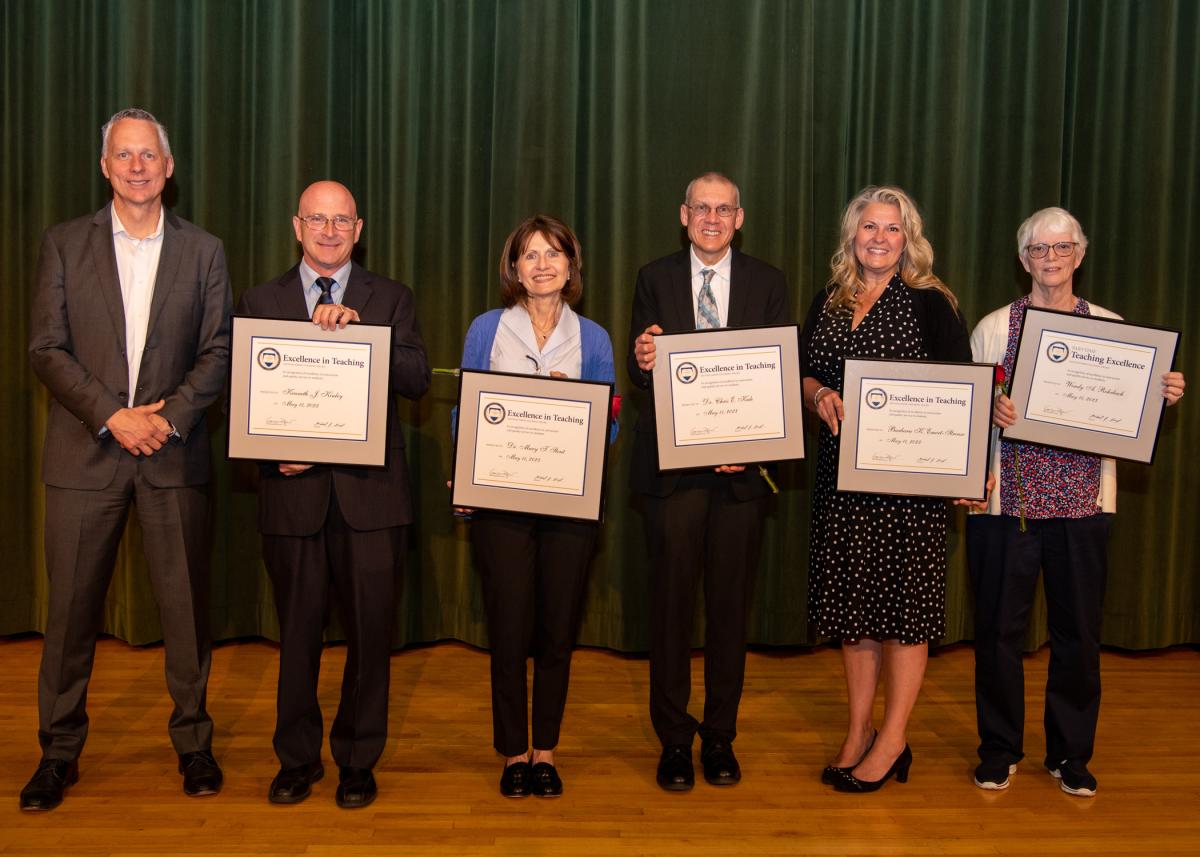 Pennsylvania College of Technology President Michael J. Reed (left) presented 2023 Excellence in Teaching Awards to (from left) Kenneth J. Kinley, Mary T. Stout, Chris E. Kule and Barbara K. Emert-Strouse; and a Part-Time Teaching Excellence Award to Wendy A. Rohrbach (at right). 