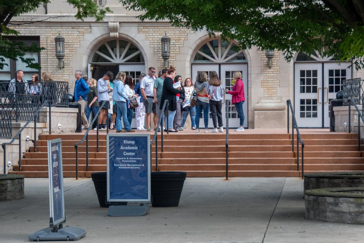 Tanae A. Traister, assistant dean of nursing and health sciences, meets with a tour group outside the Klump Academic Center.