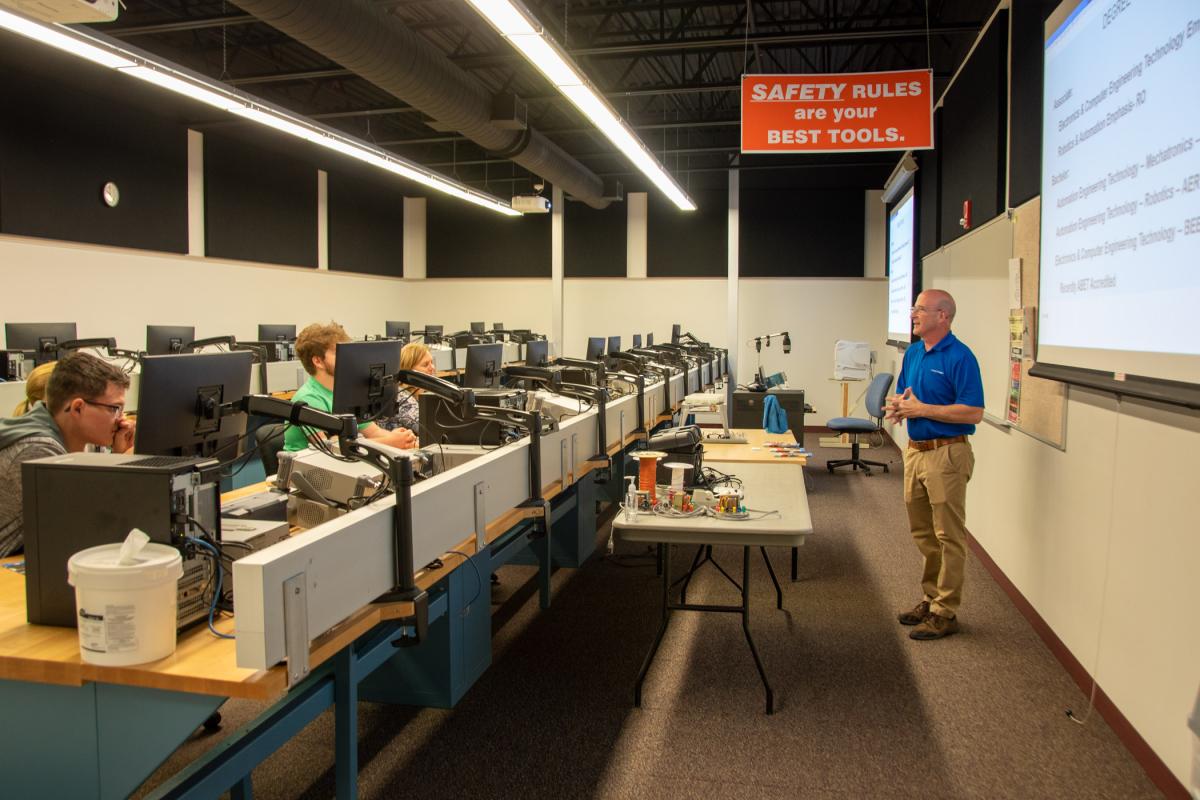 Ken J. Kinley, assistant professor of electronics, provides an overview in a highly equipped classroom.