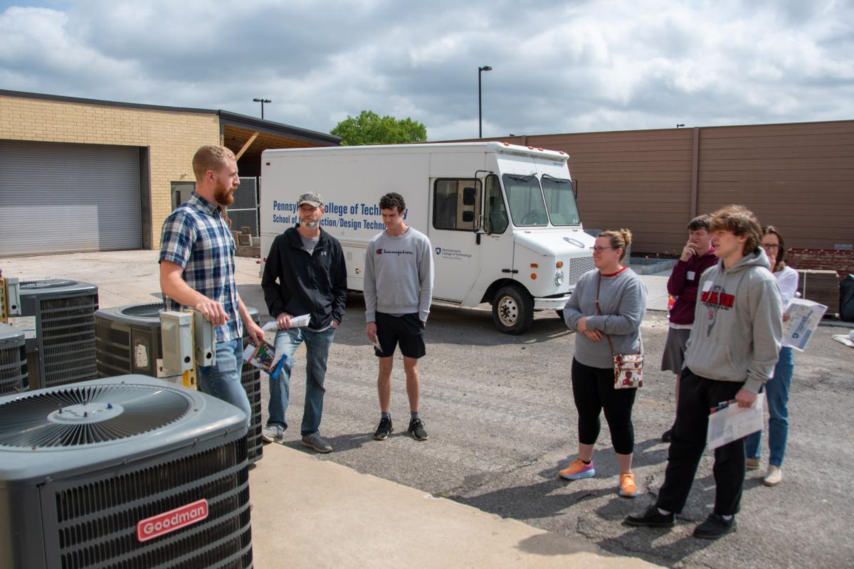 Instructor Nathan M. Swain steps outside the lab to remind prospective heating, ventilation & air conditioning technology students where a good portion of their work takes place.