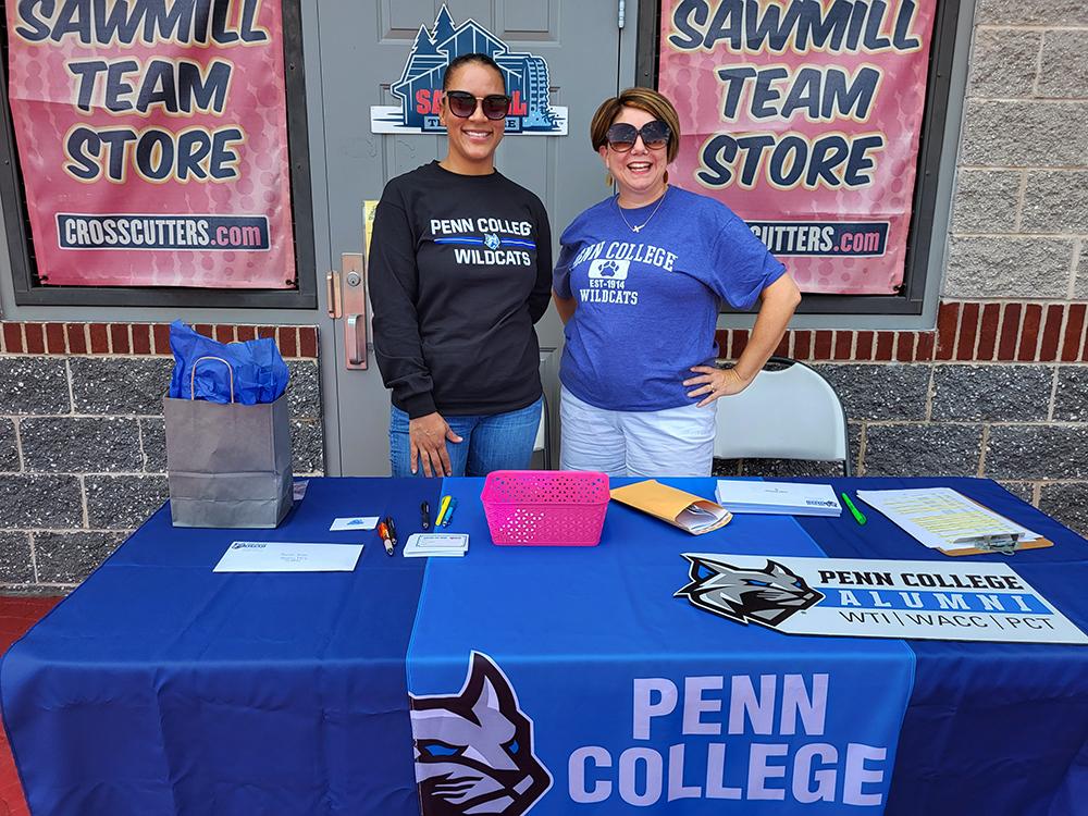 April M. Yancey (left), college relations event assistant, and Lori A. Boos, alumni and career engagement manager, were among the first friendly faces to greet alumni to the ballpark. (Photo by Tom Wilson, writer/editor-Penn College)