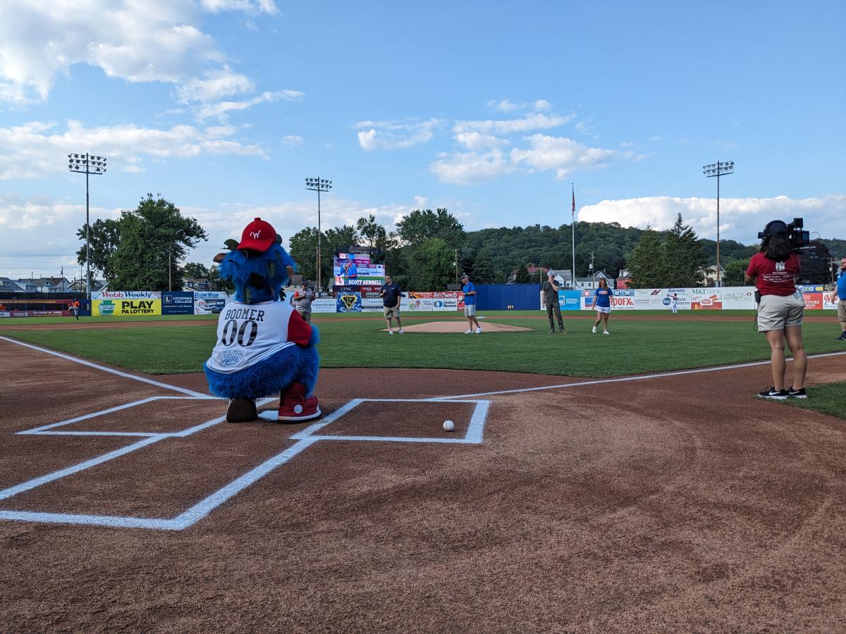 As mascot Boomer awaits their delivery, the designated hurlers for the evening's ceremonial first pitches are introduced. (Photo by Erin S. Shultz, college relations manager)