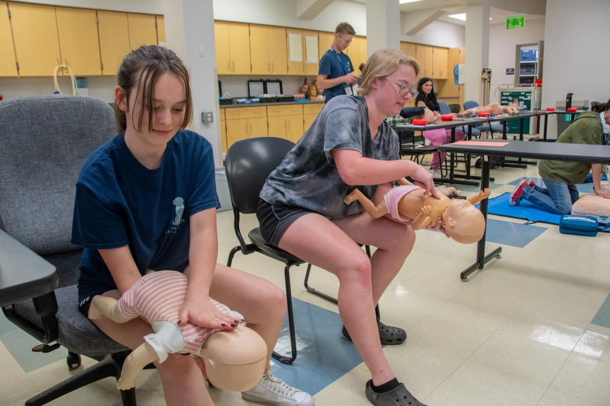 Fundamentals of Emergency Response participants practice the life-saving techniques recommended for babies that are choking. The program provided Heartsaver First Aid, CPR, AED and Stop the Bleed tourniquet training, as well as the opportunity to earn nationally recognized certification in each of those areas.