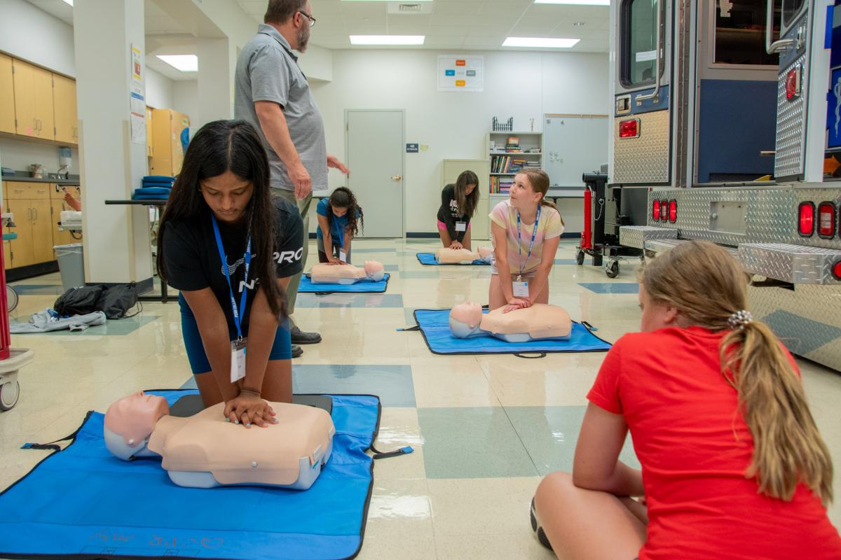 Paramedic Programs Coordinator John A. Nappi teaches participants how (and when) to provide hands-only CPR and use an automated external defibrillator.