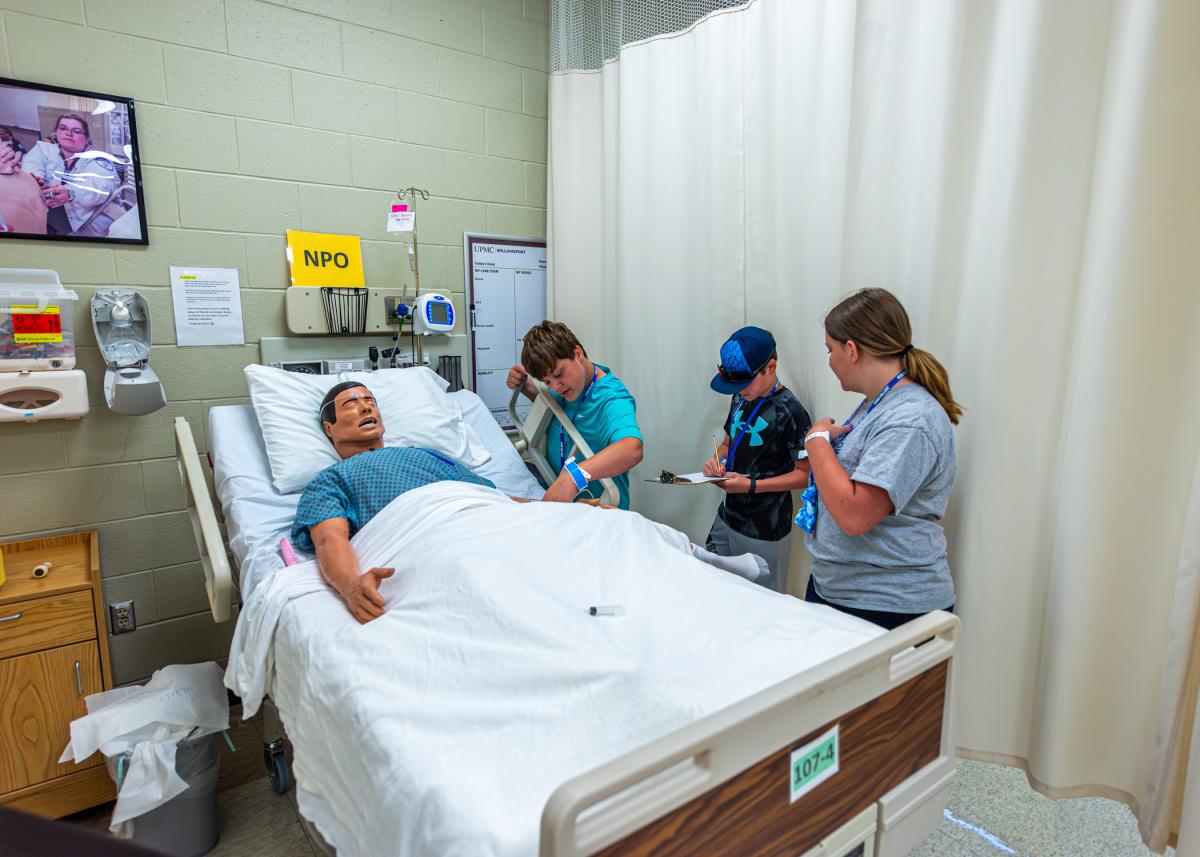 Campers tend to a "patient" in the nursing wing ...