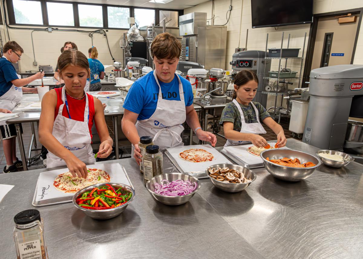 A variety of toppings allows campers to personalize their lunch on "Make Your Own Pizza" day.