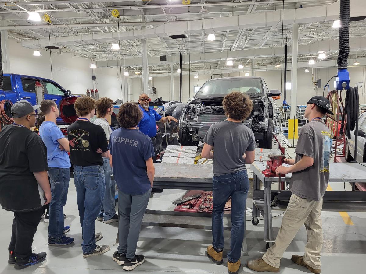 Automotive instructor Eric D. Pruden explains how equipment in the collision repair lab can assess and straighten damaged frames.