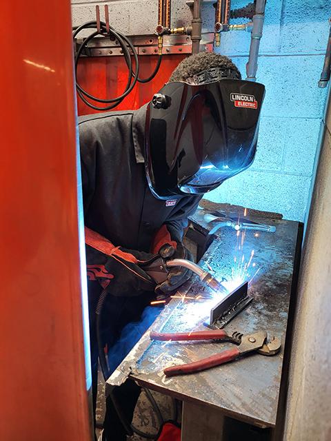 Campers donned safety gear and enjoyed hands-on experimentation in the Lycoming Engines Metal Trades Center ...