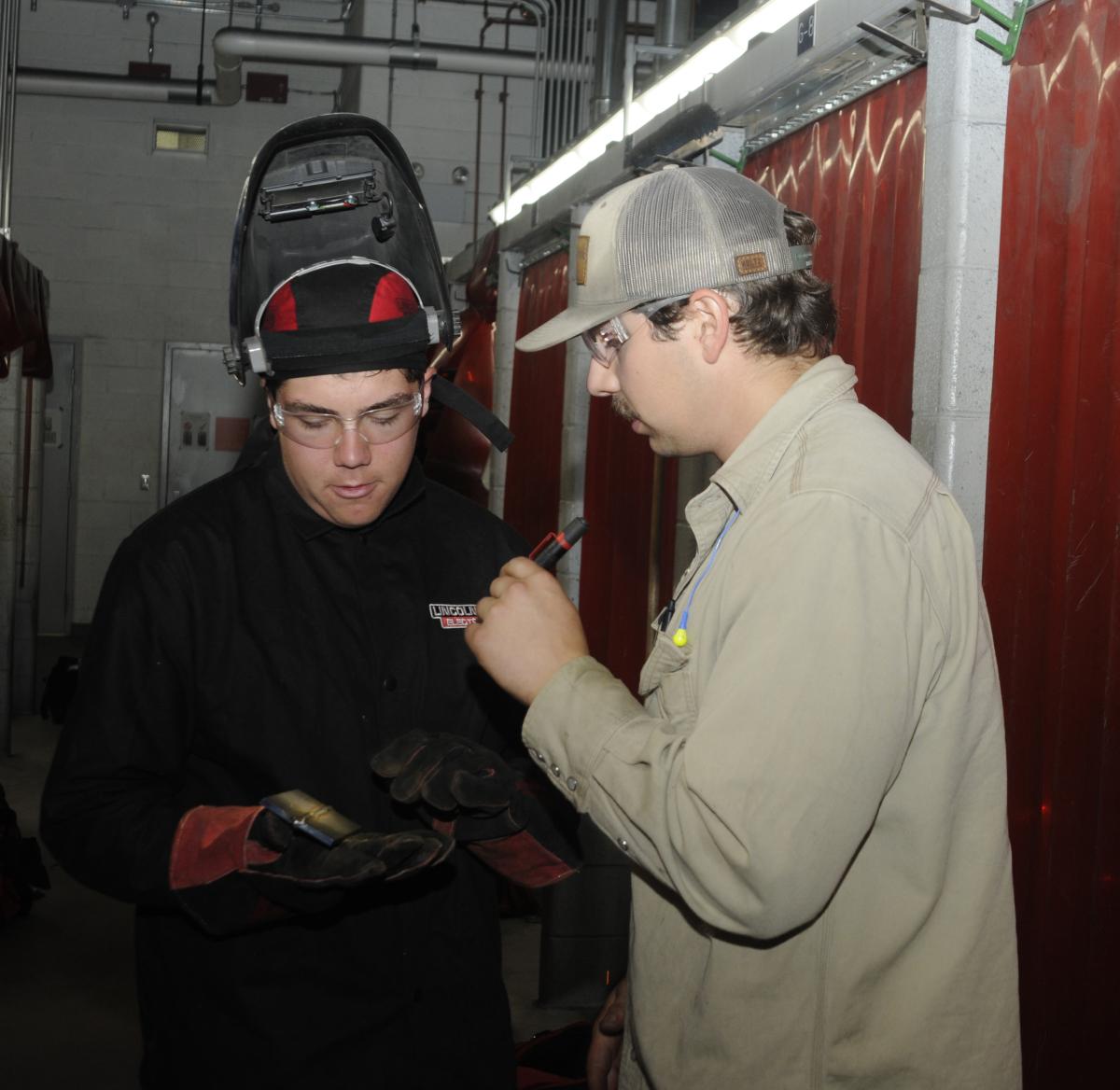 ... periodically having their welds inspected by a penlight-wielding Tyler M. Frontz, an instructor and alumnus.