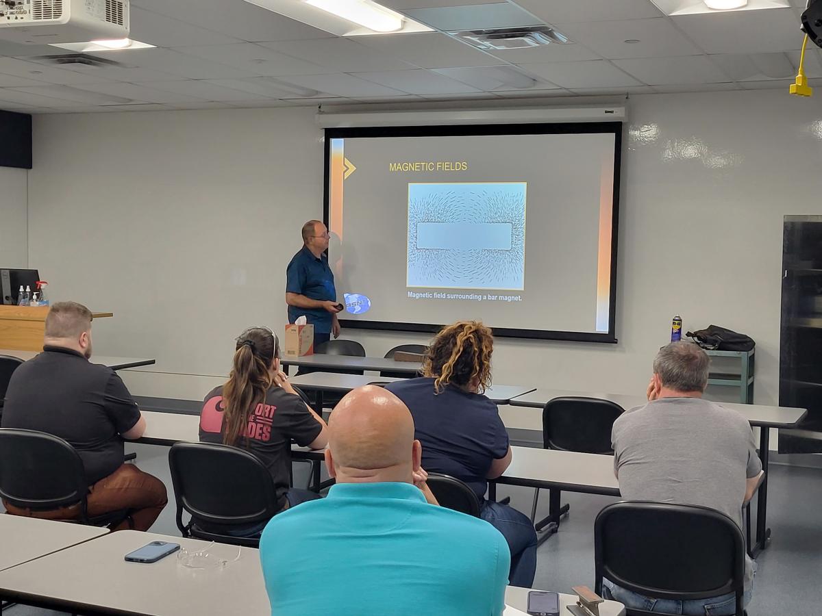 The relevance of Pre-College Programs was reinforced in a simultaneous NDT externship for teachers and counselors – note the "Support the Trades" T-shirt! Their instruction during their weeklong stay included this class with Mark N. Hurd, instructor of non-destructive testing and welding.