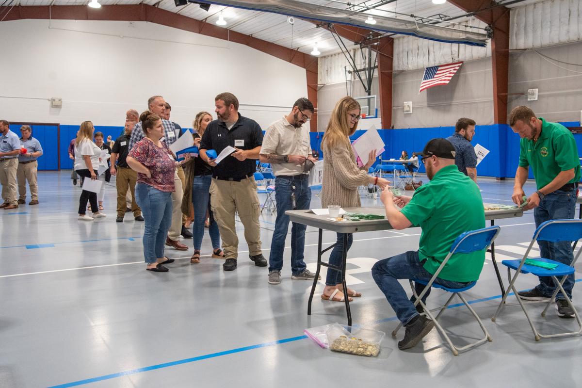 Waiting in a long line to access transportation, participants are forced to feel the frustrations and juggle the bureaucracies their clients often encounter. 