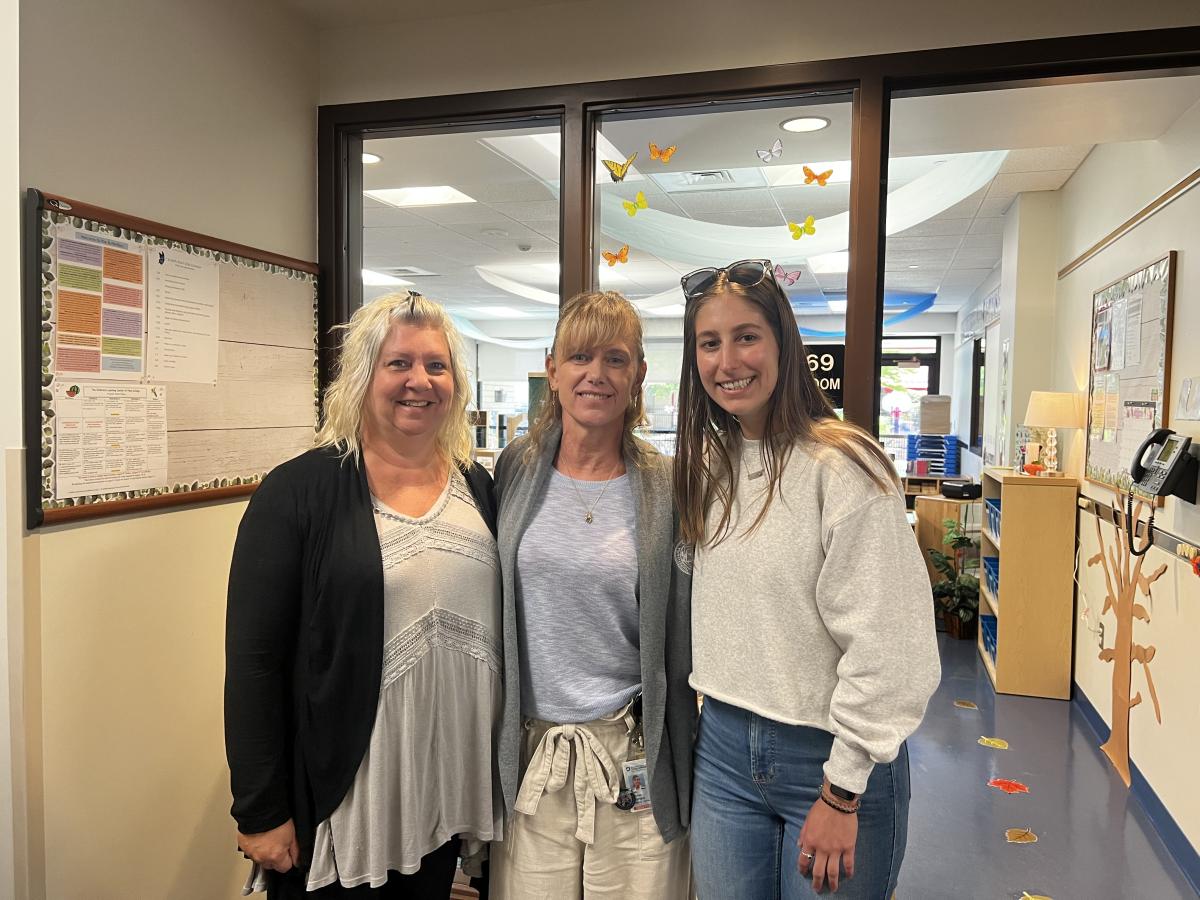Teacher Rebecca L. Helminiak (right) and assistant teacher Candi Leisenring (left) are welcomed to the staff by Linda A. Reichert, director of the Children's Learning Center.