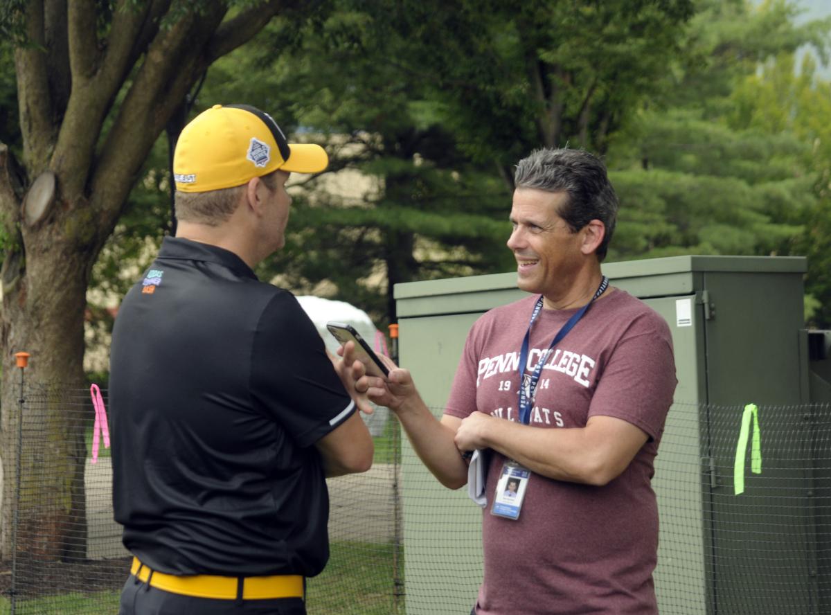 Tom Speicher, a writer/video producer at the college and part of the Little League radio team for better than a quarter-century, interviews Southeast coach Randy Huth – whose Nolensville, Tenn., team is making its third consecutive appearance in the Series bracket.