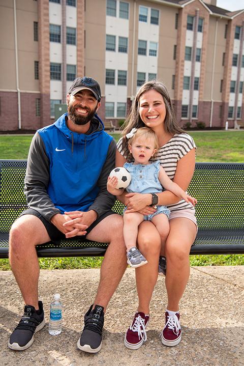  Lacrosse coach Jordan G. Williams enjoys the evening with his wife and daughter. A Wildcat family, indeed ... and, judging by the soccer ball, that includes ALL Wildcats!