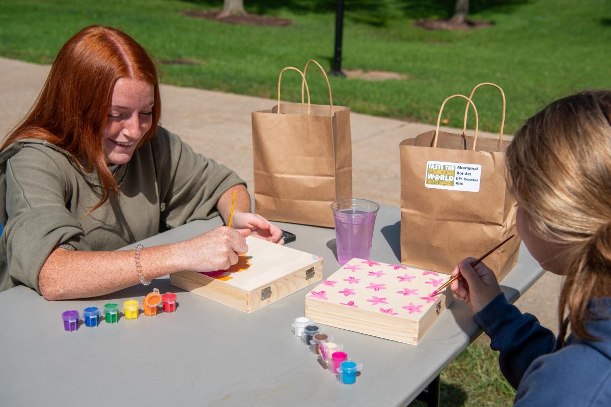 Teagan A. Willey (left), pre-dental hygiene – B.S., enjoys crafting in the sunshine with her roommate, Alexa M. Tupper, pre-physical therapist assistant.