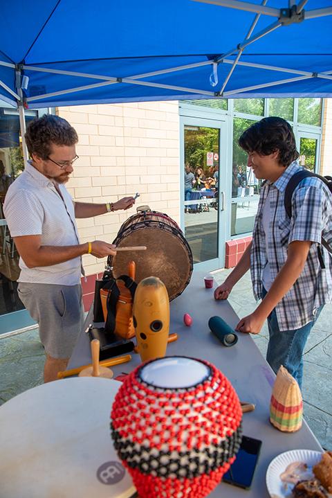 Freshman Joshua C. Schmidt (right), building automation engineering technology, gets a “drum lesson” from Urie Kline, who teaches the World Drumming Lab at Lycoming College (and he says Penn College students can engage in that course through the colleges’ cross-registration program). Kline is an adjunct faculty member at Lyco and also at Bucknell University.