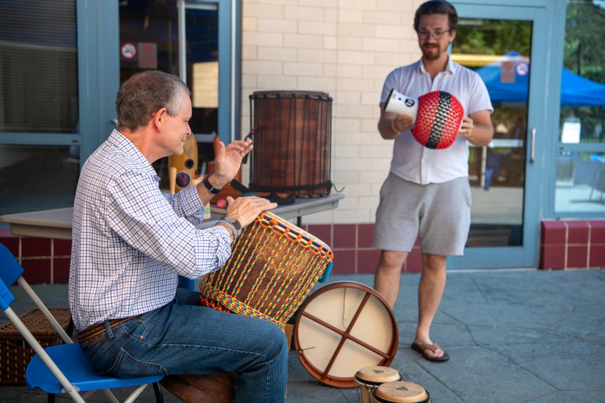 Joseph E. LeBlanc, assistant professor of physics, joins Kline for an impromptu drumming session.