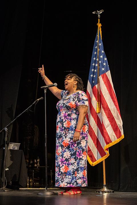 Tamaka F. Carter – a financial aid assistant, alumna and current marketing student – hits a high note during her glorious rendition of the national anthem.