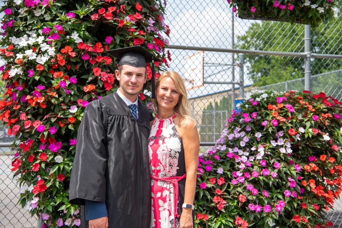 Griffin D. Kunze, manufacturing engineering technology, captures a keepsake with his mother. 