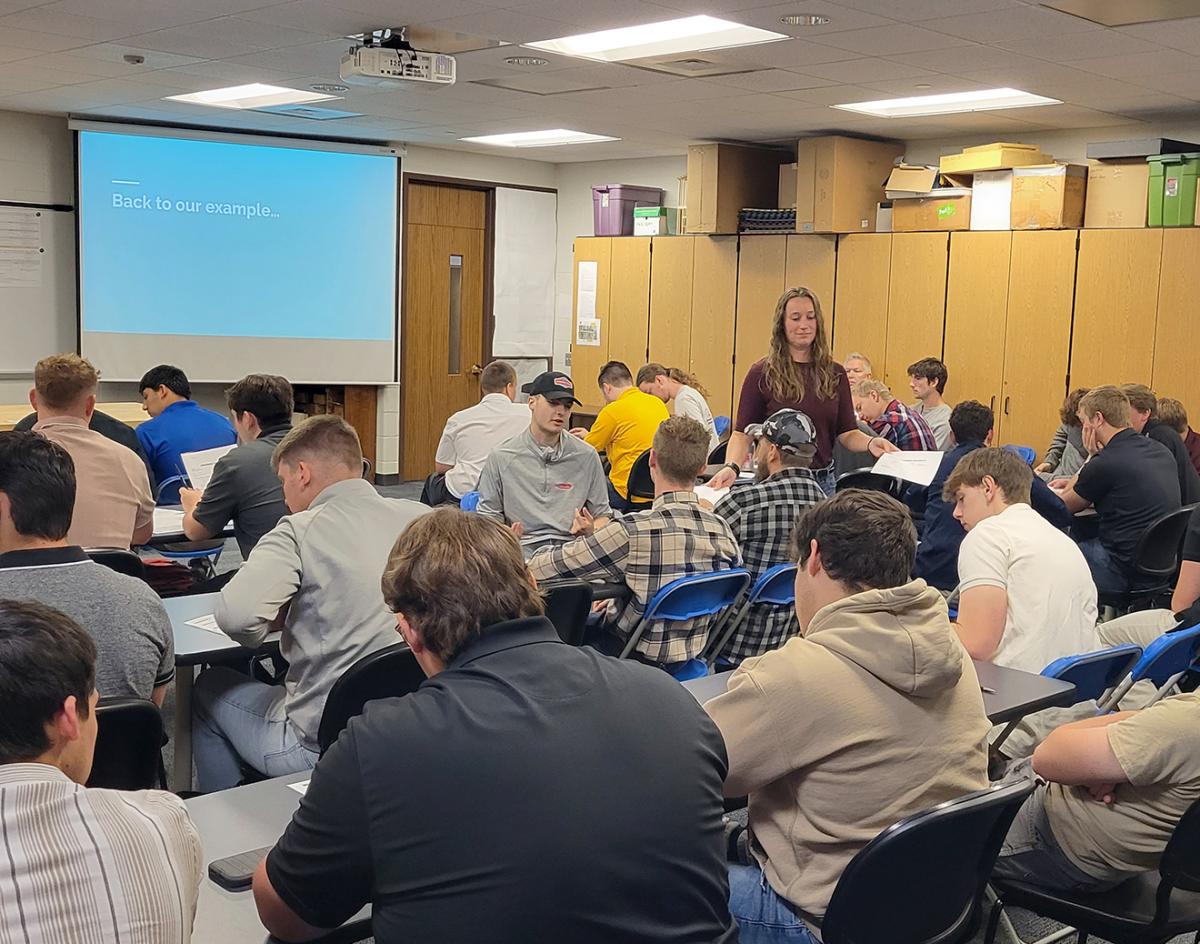 Lauren S. (Herr) Bucher, a 2019 construction management graduate now employed by Wagman Inc. as an estimator, adds to current students' real-world exposure through a hands-on assignment in "Purchasing Power." Bucher kicked off two days of Alumni in the Classroom sessions as part of her major's 30th anniversary celebration.