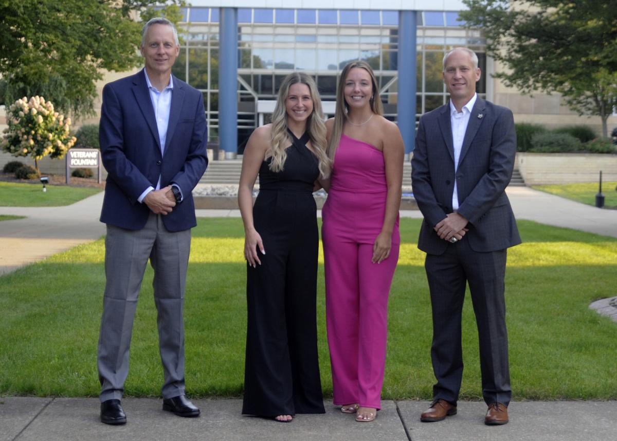 This year's Athletics Hall of Fame inductees (both coincidentally graduates of Lampeter-Strasburg High School in Lancaster) join President Michael J. Reed (left) and Scott E. Kennell, director of athletics, for a pre-reception photo on the campus mall. Robyn E. Beddow (second from left) earned two occupational therapy assistant-related degrees in 2015 and 2016, and Hailee L. Hartman is a 2019 nursing grad.