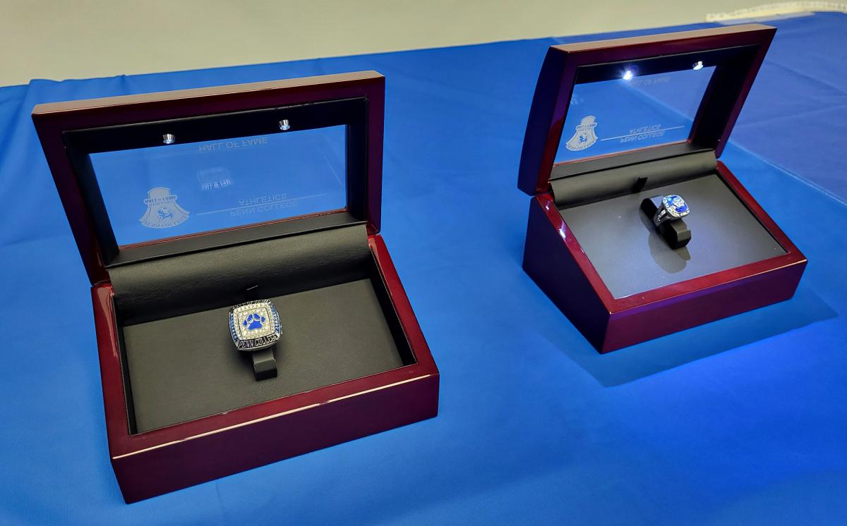 Shimmering in their lighted cases, the Hall of Fame rings await the official presentation.