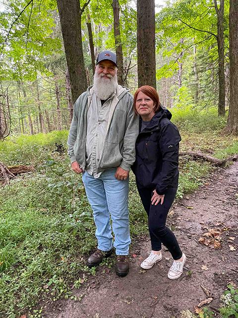 Undeterred by less-than-ideal weather, Arthur and Aimee Neary, of Columbia, N.J. embrace the trail. Their daughter, Elloree Eliza, a first-year welding student, stayed behind, opting for the dry warmth of the great indoors.