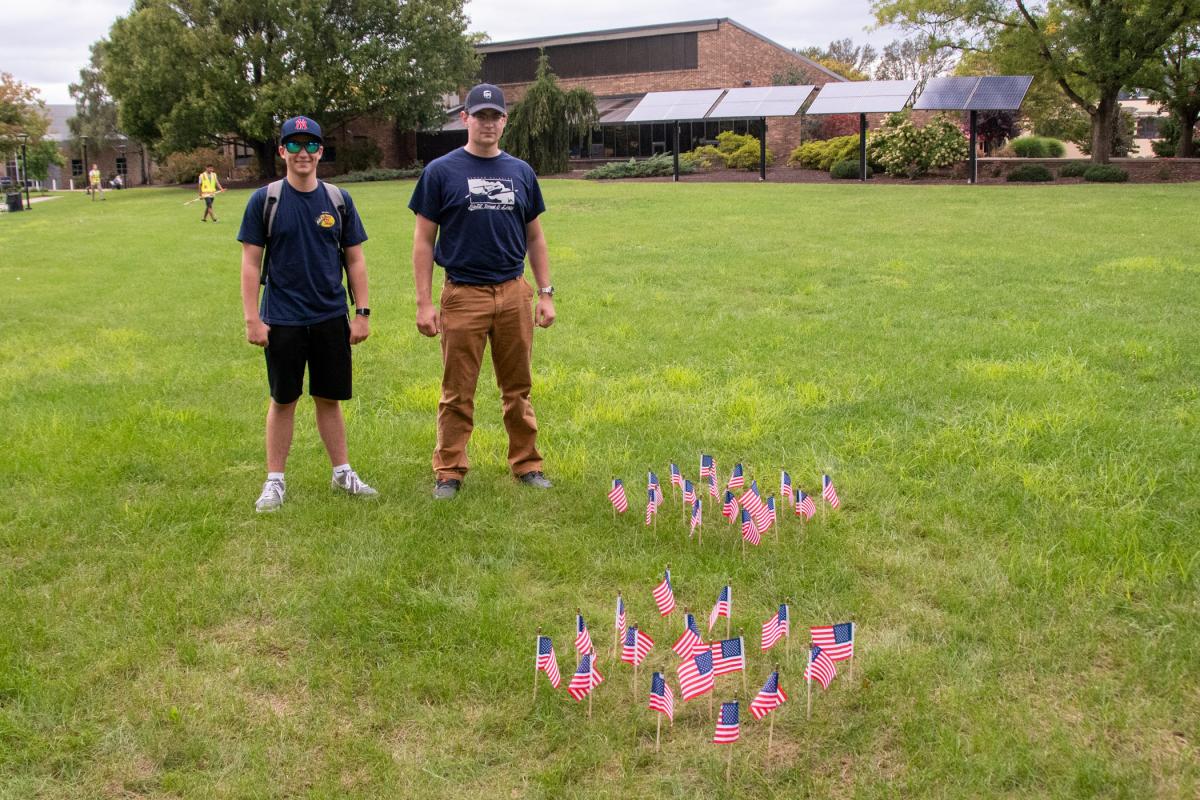 Students Ryan Fizer and Steven M. Gautsch made a point to plant flags to honor the memory of the lives lost in the terrorist attacks of Sept. 11, 2001.