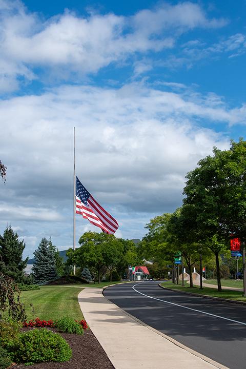The flag at the college’s main entrance stands at half-staff to remember the events of 22 years ago.