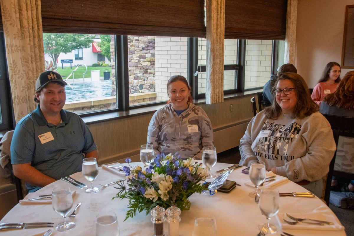 Escaping the damp weather for a dinner buffet in Le Jeune Chef Restaurant are (from left) Eli and Amanda (Ritter) Zimmerman and Abigail Sneeringer. Amanda Zimmerman graduated in building science & sustainable design: architectural technology concentration in May; Sneeringer completed a bachelor’s in human services & restorative justice in 2022.