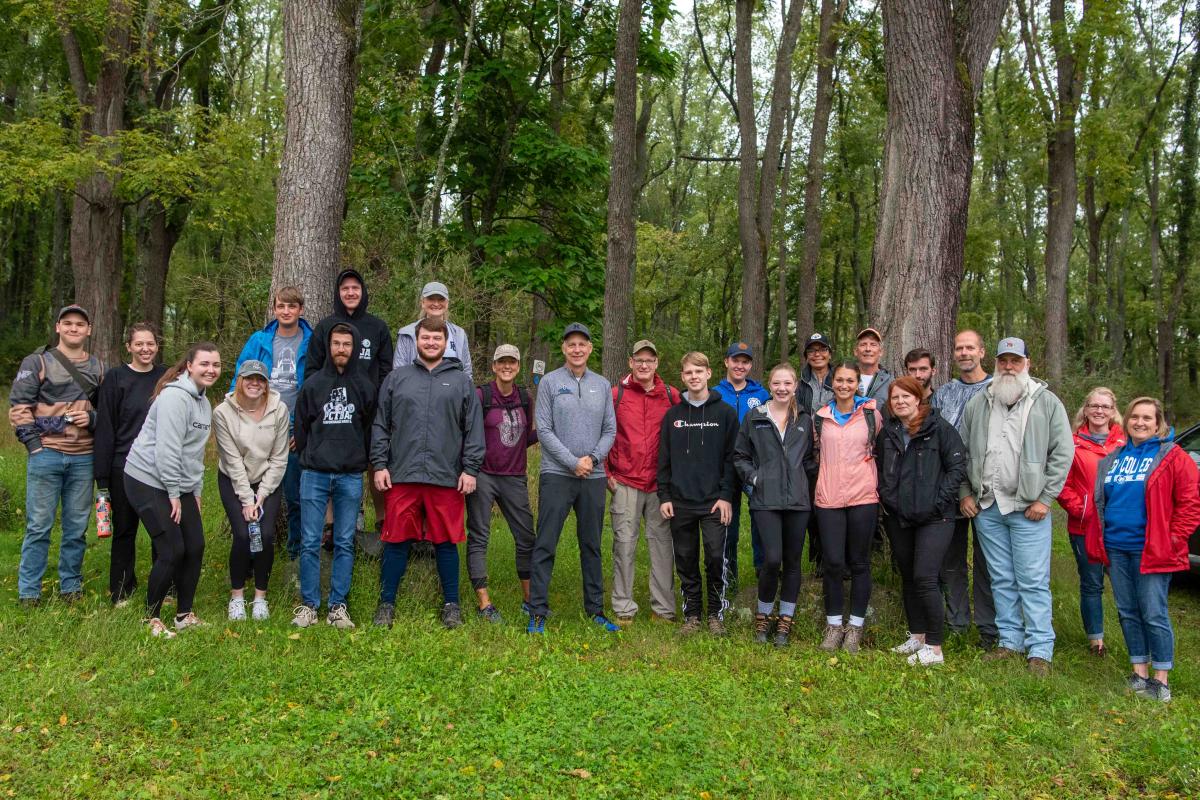 A group of hardy souls showed up in the rain for a crisp Saturday morning hike with the college president (at center in gray top). The happy hikers included students, parents, alumni and college employees. 