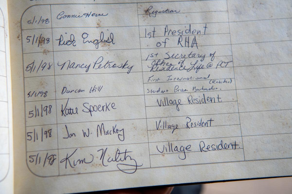 A guest book revealing those present during the 1998 dedication of the time capsule shows their signatures: Katie Spoerke and Jon W. Mackey.