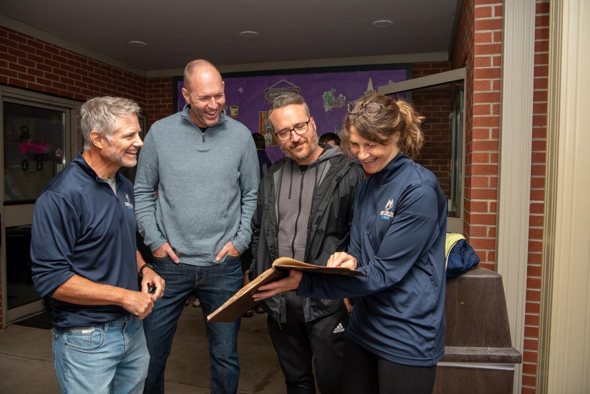 Mallery and the Mackeys enjoy a trip down memory lane along with Kevin L. Imes (second from left), construction management, ’07, and building construction technology, ’03. 