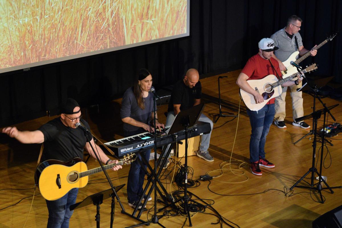 Performing on the ACC stage are (from left) Nate Carpenter, Amanda Hoover, Andy Hamelly, Aaron Tokay and Randy Wandell. Not pictured, but nearby: Tate Naugle, sound; and Lee Baird, on electric guitar.