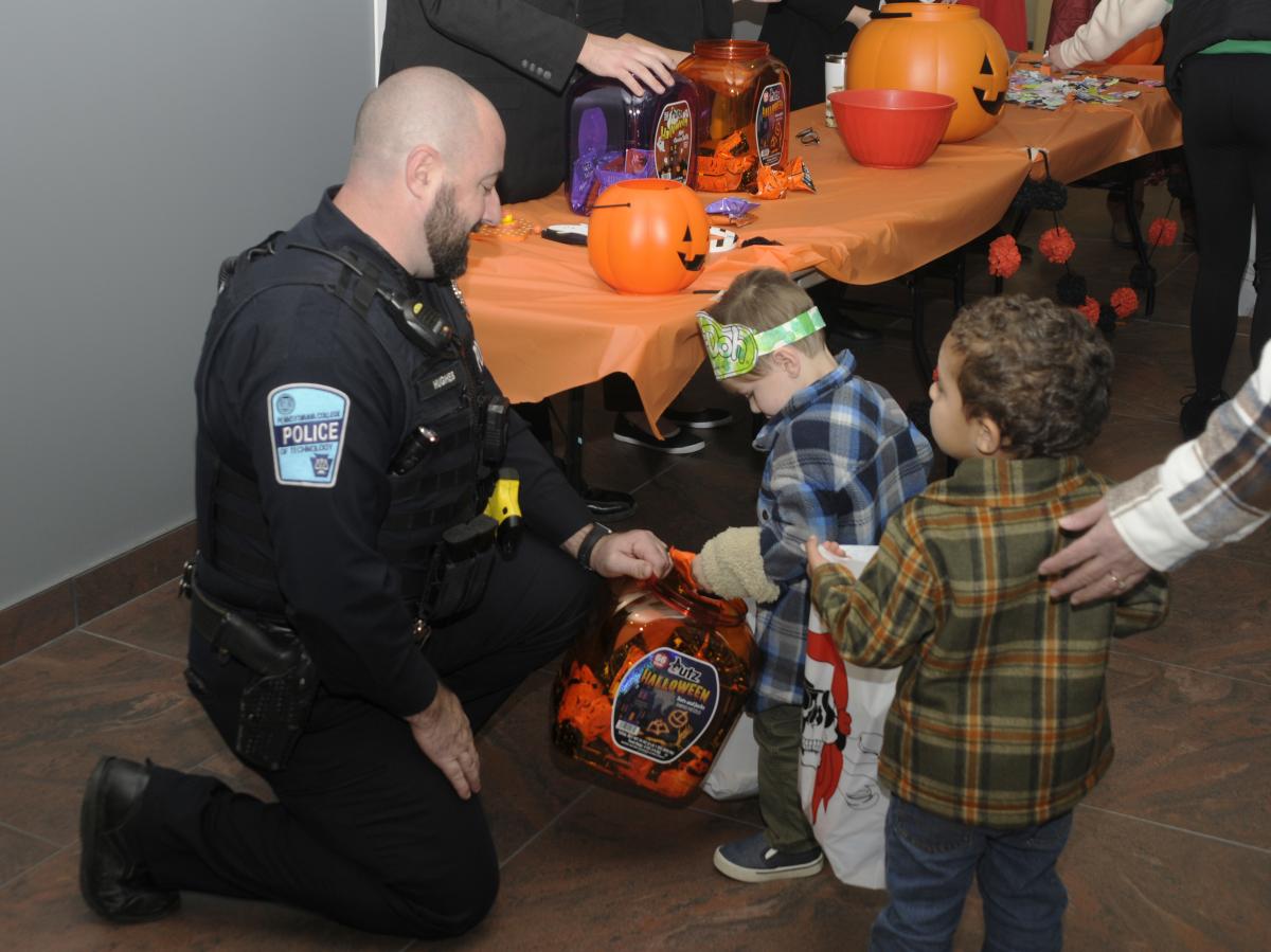 Penn College Police Officer Jeffrey L. Hughes Jr. shares his pretzel supply.