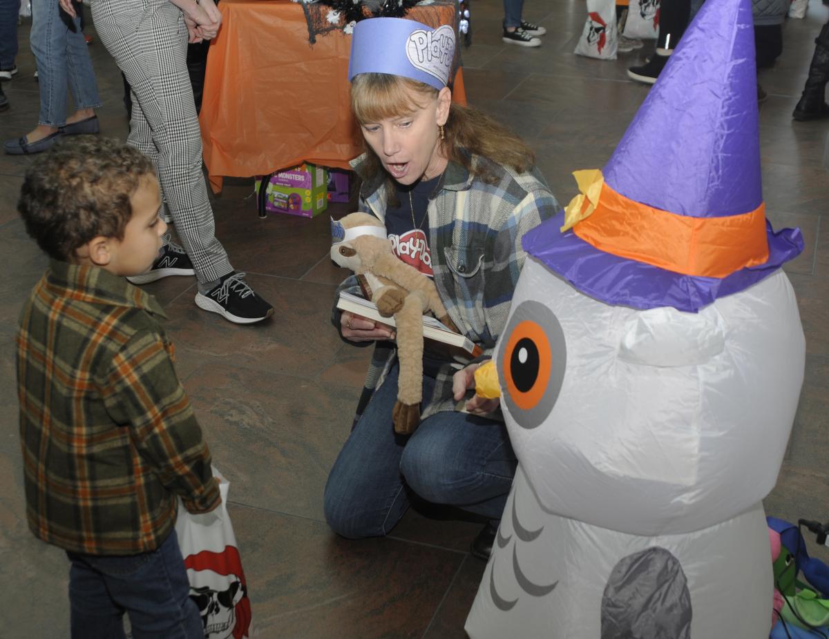 CLC Director Linda A. Reichert and friend get acquainted with a decorative owl.