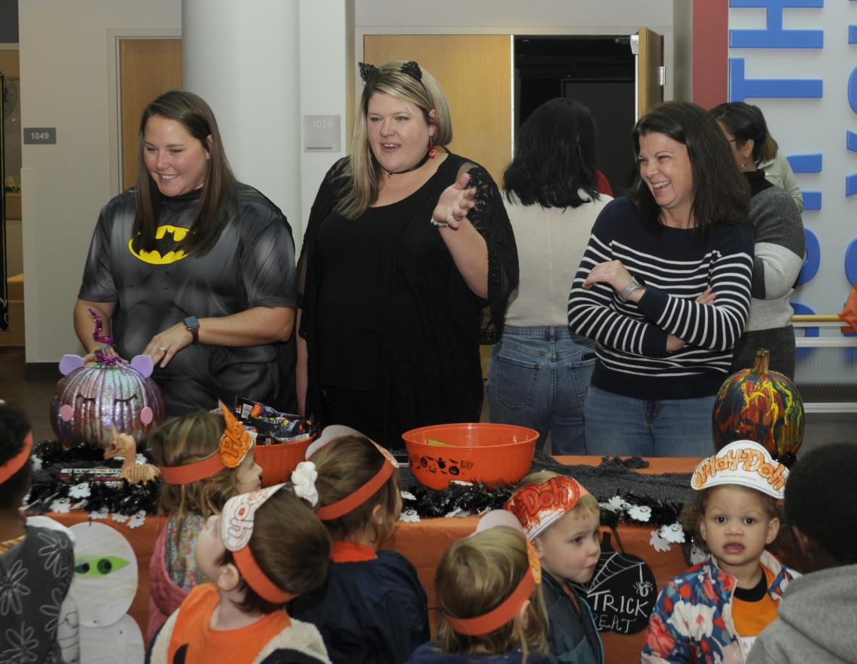 Enjoying the Halloween visitors to People & Culture's well-stocked table are (from left) Jessica M. Boyd, generalist; Mattie L. Pulizzi, manager of employee engagement; and Margaret D. McCracken, manager of talent acquisition.