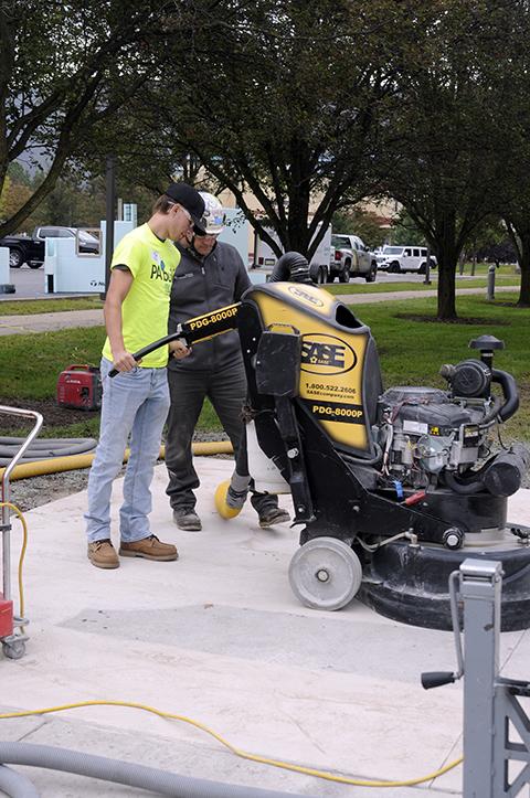 Hands-on activities gave the day's visitors ample opportunity to try out a number of processes and possibilities, such as this grinder provided by Durable Surfaces LLC.