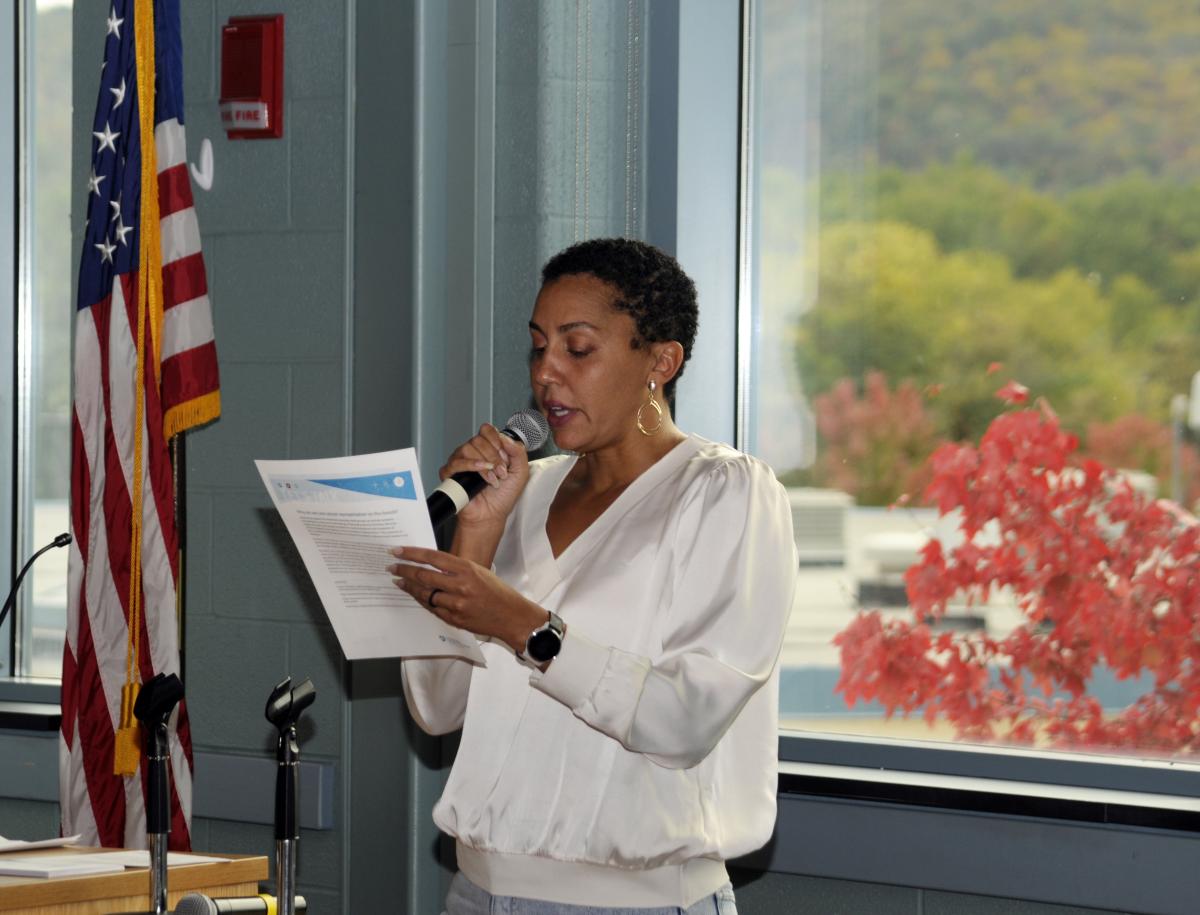 PageCarol Woods, assistant dean for student success at Lycoming College, reads a prompt for small-group discussion ...