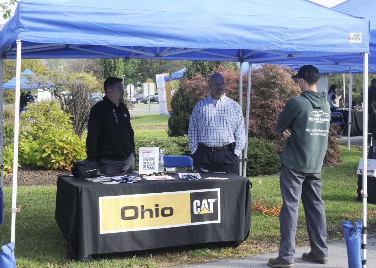 Ohio CAT's Jason Berens (left), employment specialist, and Ryan Boyer, branch product support manager in the company's Power Systems Division, were impressed throughout the day by the students they met.